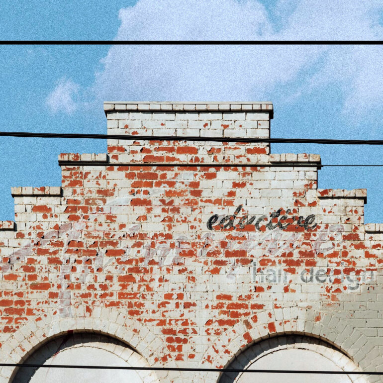 Stepped brick parapet with faded lettering, Carlton, Melbourne inner north, hidden__north documentary photography
