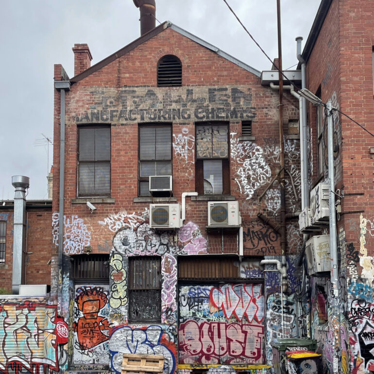 Graffiti-covered rear wall of an old brick factory, Melbourne inner north, hidden__north documentary photography