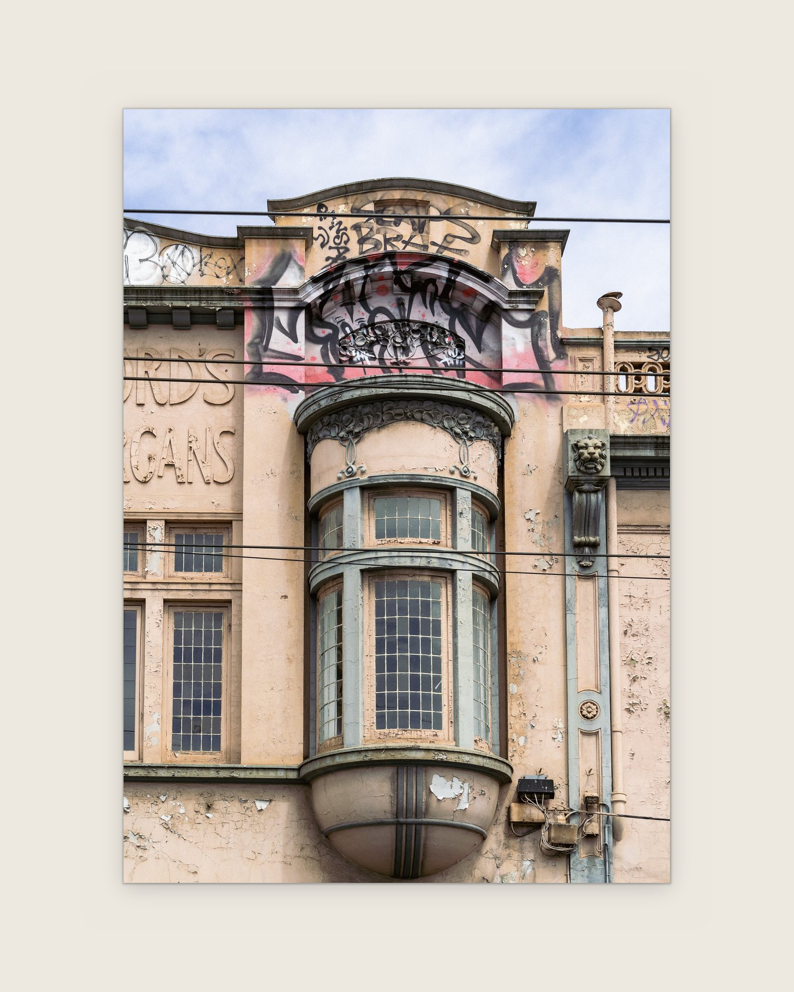 Art nouveau bay window under a graffiti-tagged pediment, Collingwood, Melbourne inner north, hidden__north documentary photography