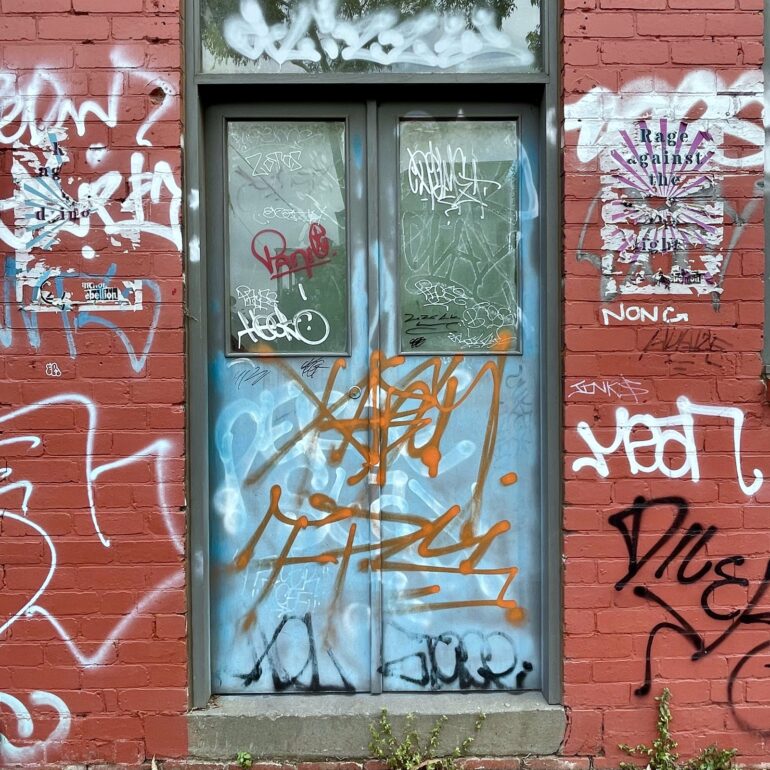 Tagged glass double doors, red brick laneway, Melbourne inner north, hidden__north documentary photography