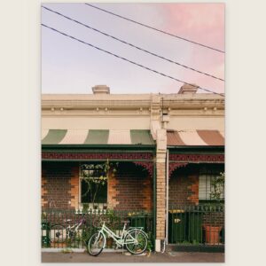 Victorian terraces with striped verandah awnings and a bicycle against the iron lace, Carlton, Melbourne inner north, hidden__north documentary photography