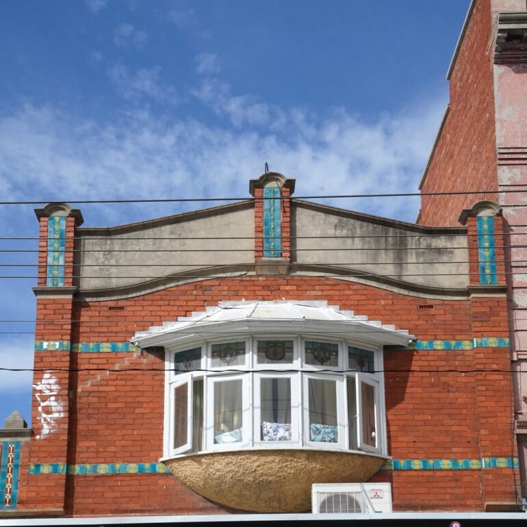 Edwardian bay window with tiled pilasters above Francesca's, Northcote, Melbourne, hidden__north documentary photography