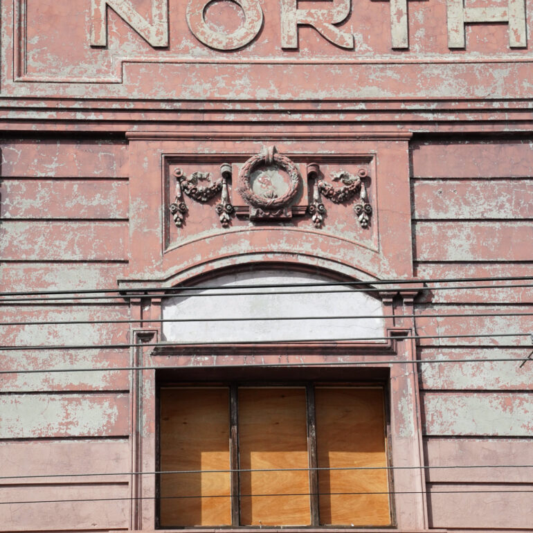 Pink parapet with NORTH lettering, Northcote, Melbourne inner north, hidden__north documentary photography