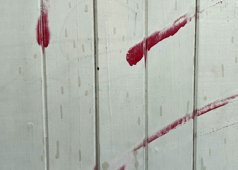 Red paint strokes on white weatherboard, Melbourne inner north, hidden__north documentary photography