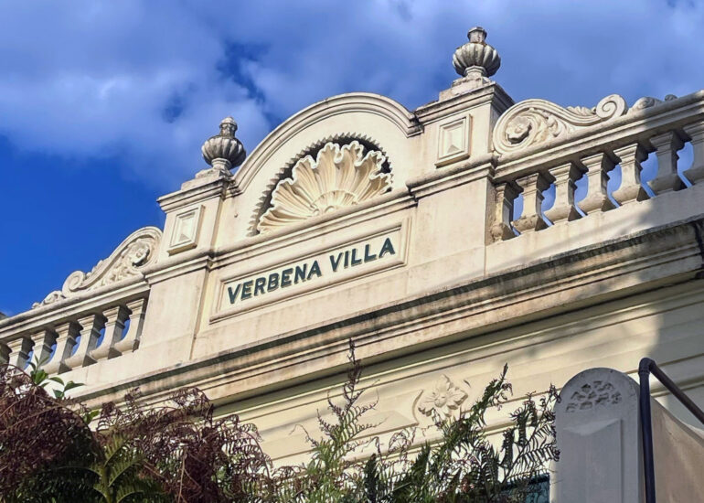Verbena Villa parapet against blue sky, Melbourne inner north, hidden__north documentary photography