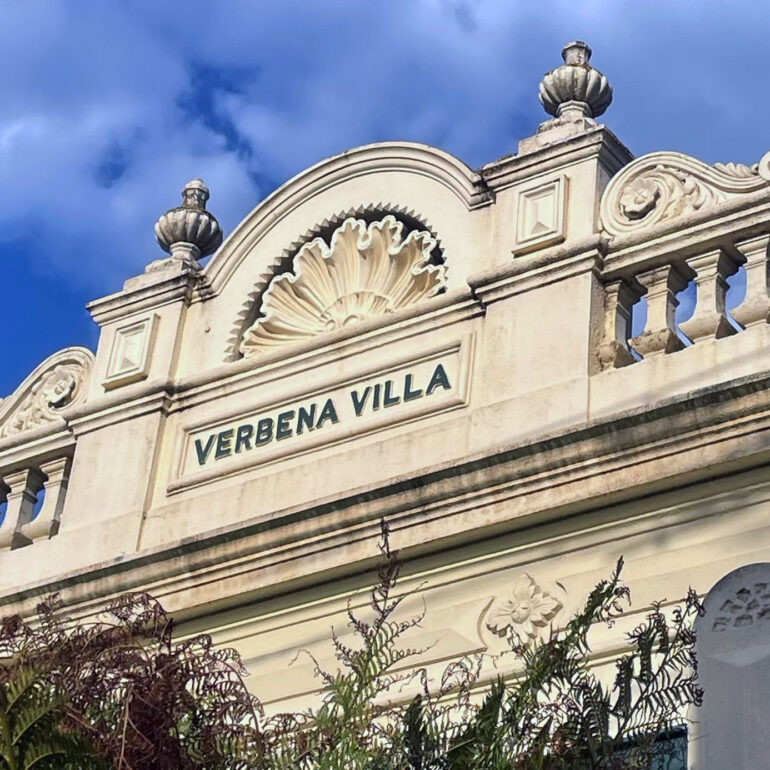 Verbena Villa parapet against blue sky, Melbourne inner north, hidden__north documentary photography