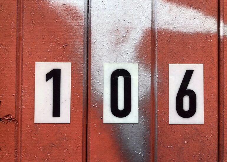 Red painted door, number 106, Melbourne inner north, hidden__north documentary photography