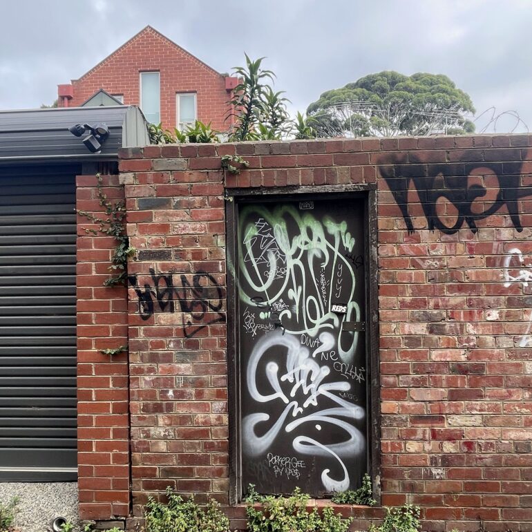 Timber door with brick surround detail, Melbourne inner north, hidden__north documentary photography