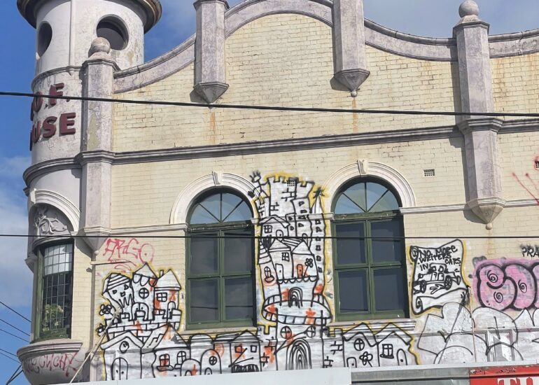 Turret building with cartoon mural facade, Melbourne inner north, hidden__north documentary photography