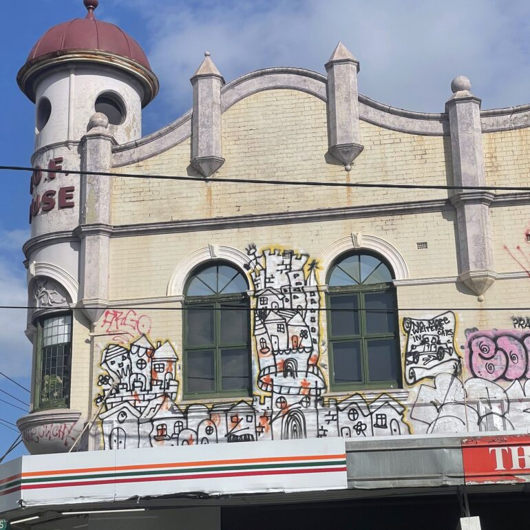Turret building with cartoon mural facade, Melbourne inner north, hidden__north documentary photography