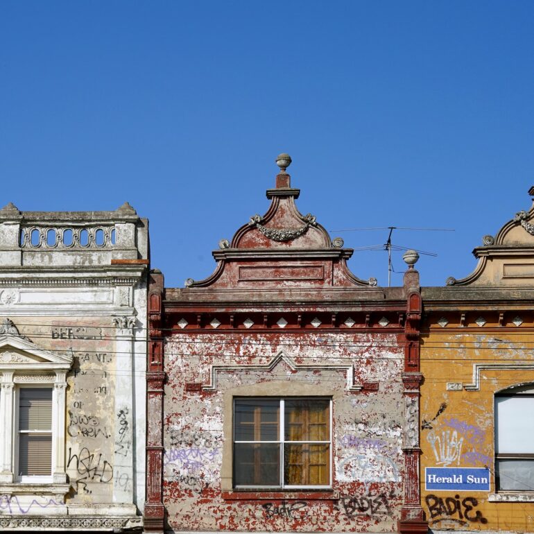 Row of three Victorian parapet shopfronts, Melbourne inner north, hidden__north documentary photography